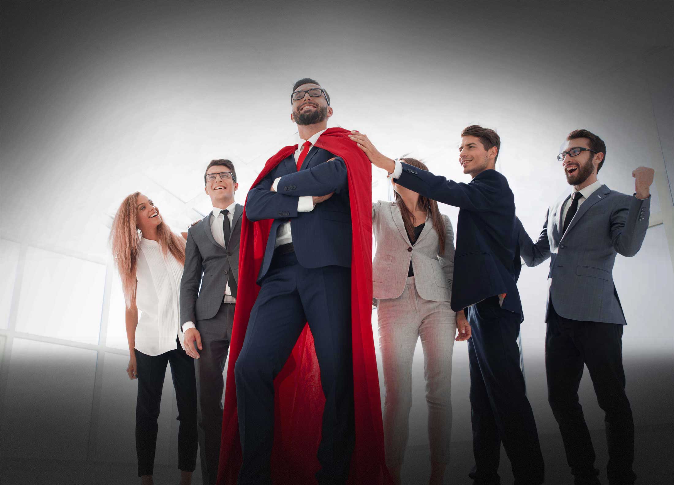 boss is a superhero and the business team is standing together